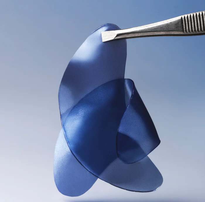 Summer Fridays blue hydrogel under-eye patch held with tweezers