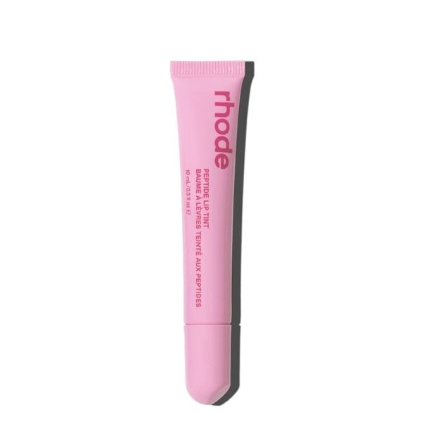 Pink tube of Rhode lip balm on a white background