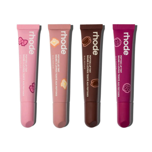 Four lip balm tubes from Rhode on a white background
