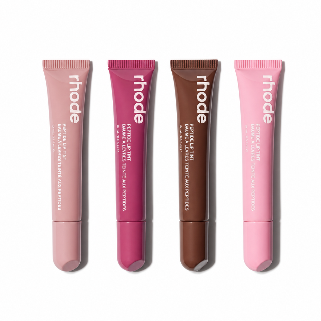 Four lip tint tubes from the brand 'rhode' on a white background
