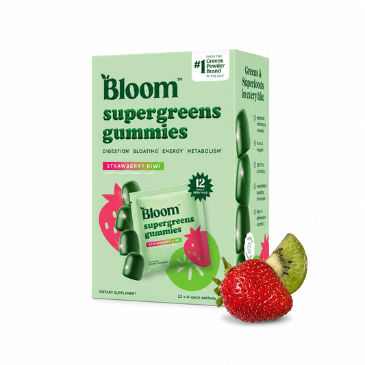 Box of Bloom supergreens gummies with a strawberry and kiwi on a white background