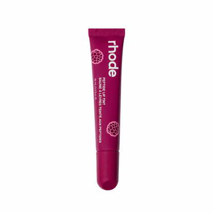 Dark berry/magenta lip balm tube with 'rhode' branding on a white background