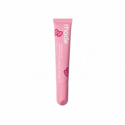 Pink lip balm tube with 'rhode' branding on a white background