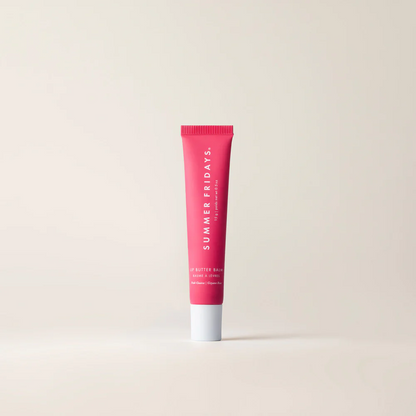 Pink tube of Summer Fridays lip balm on a beige background