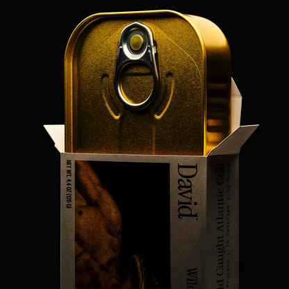 Gold canned food with 'David' branding on a black background