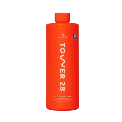 Orange bottle of Tower 28 facial spray on a white background