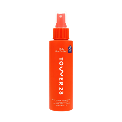 Orange spray bottle labeled 'Tower 28' on a white background