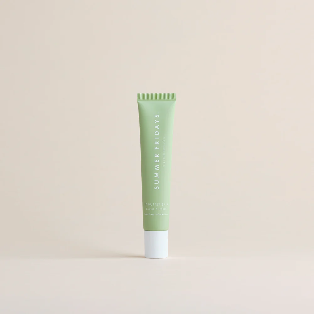 Green tube of 'Summer Fridays' product on a beige background