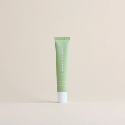 Green tube of 'Summer Fridays' product on a beige background