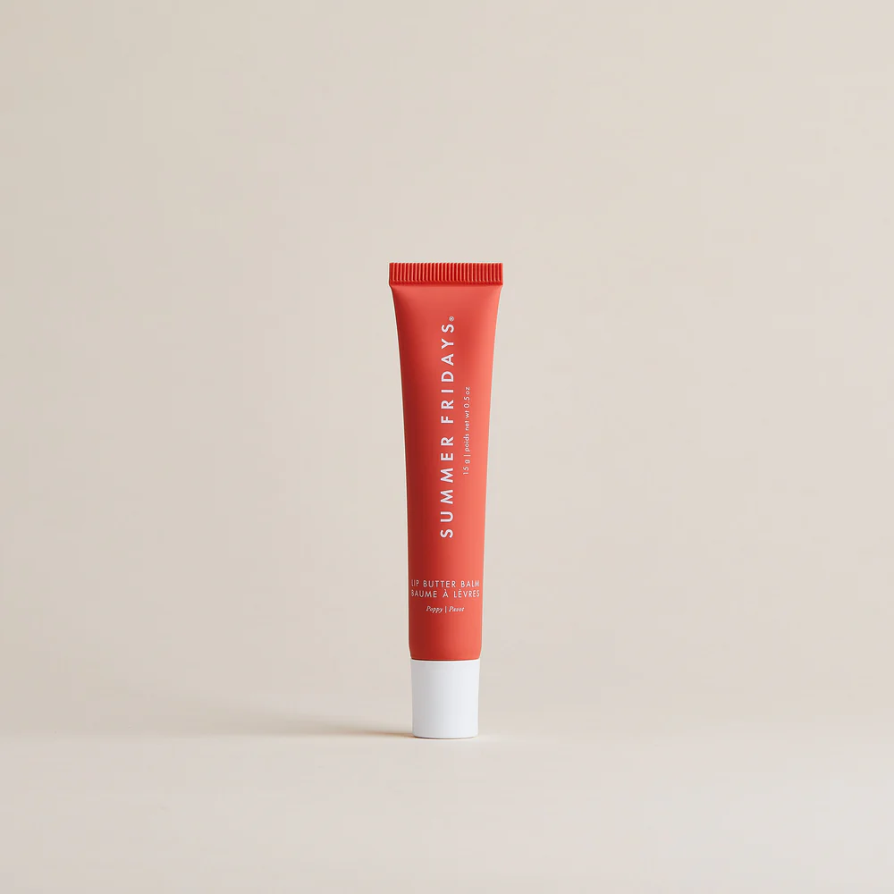 Red tube of Summer Fridays lip balm on a beige background