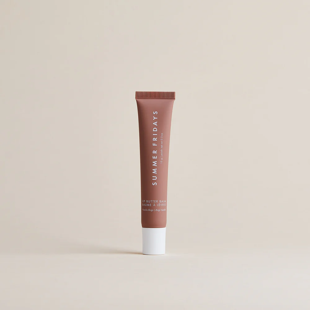 Brown tube of lip balm with 'Summer Fridays' branding on a beige background