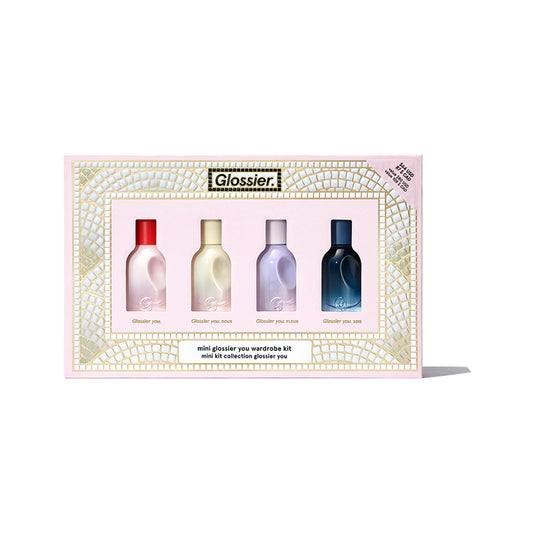 Mini Glossier You Wardrobe Kit set box with four mini fragrance bottles on a white background