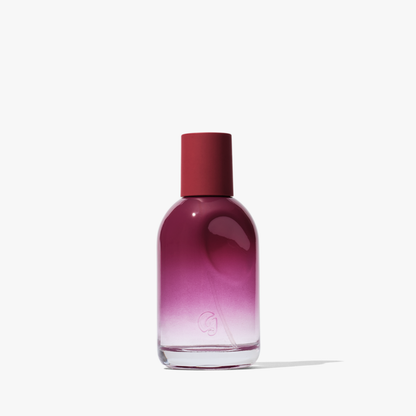 Gradient purple bottle with red cap on a white background