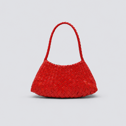 Red woven handbag on a light gray background